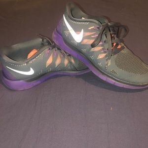 Purple, pink, and gray Nike Free runs 5.0
